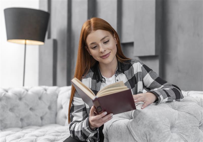 lovely-woman-reading-book-indoors