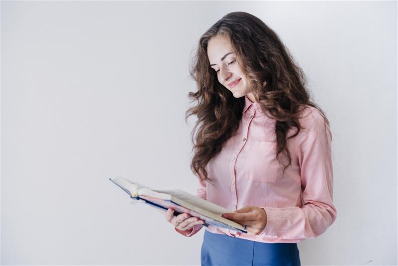 young-female-reading-book-studio